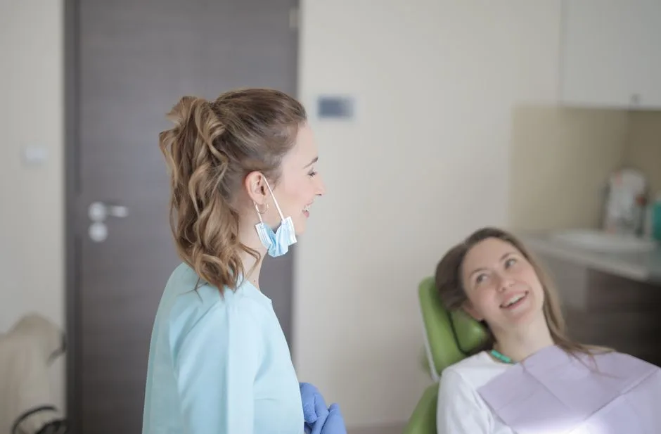 compassionate dentist talking to a patient - Dental anxiety treatment