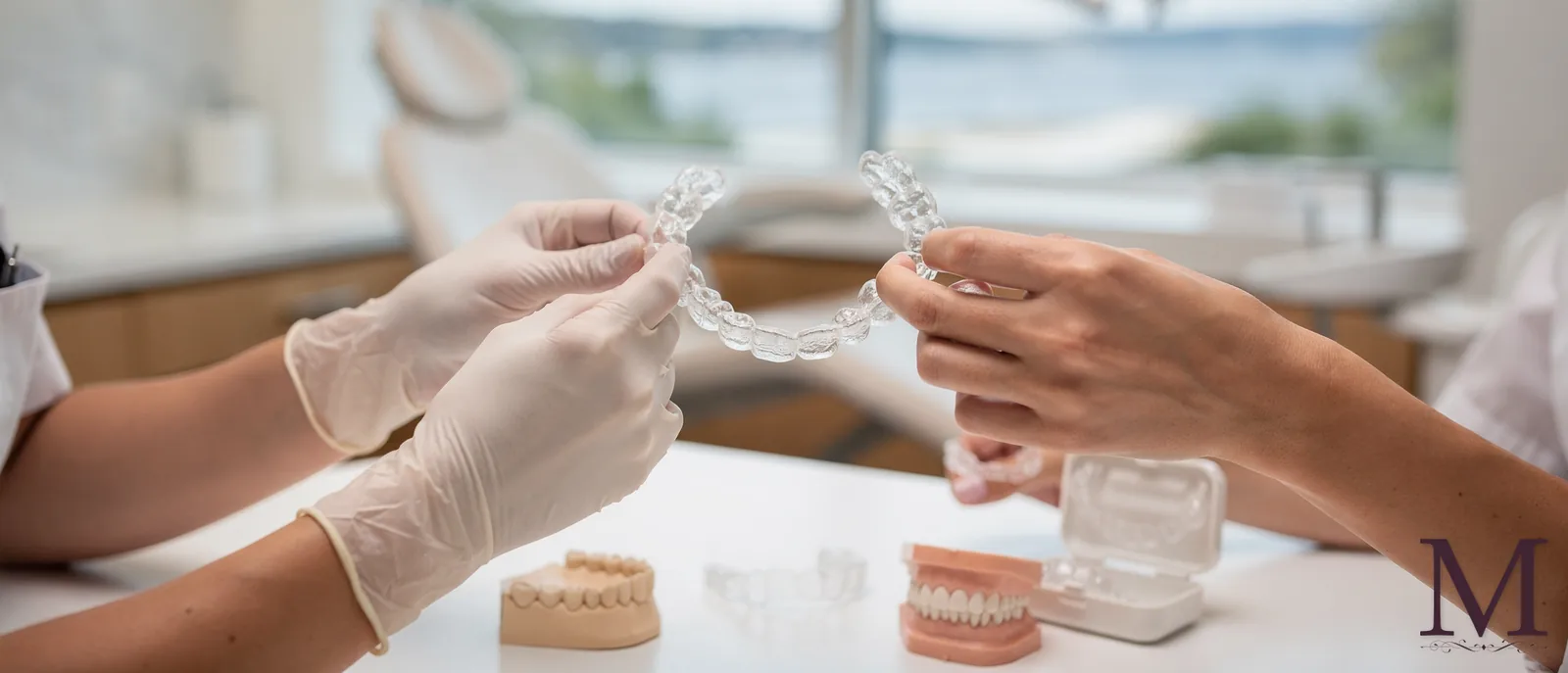 Clear aligners and dental model illustrating Invisalign and SureSmile treatment options at Arista Dental Care